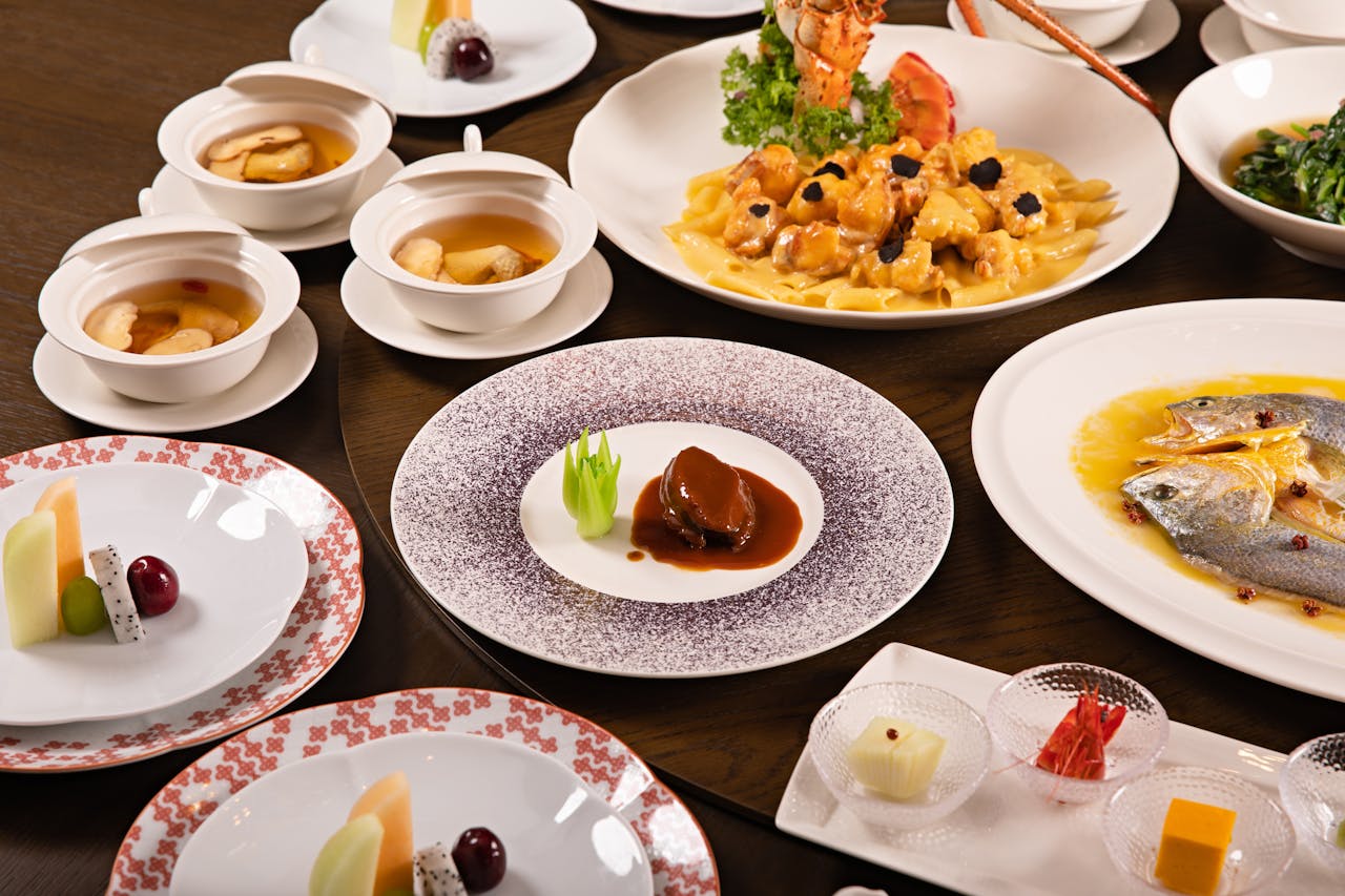 contact-img A diverse array of Chinese cuisine elegantly presented for a banquet setting.