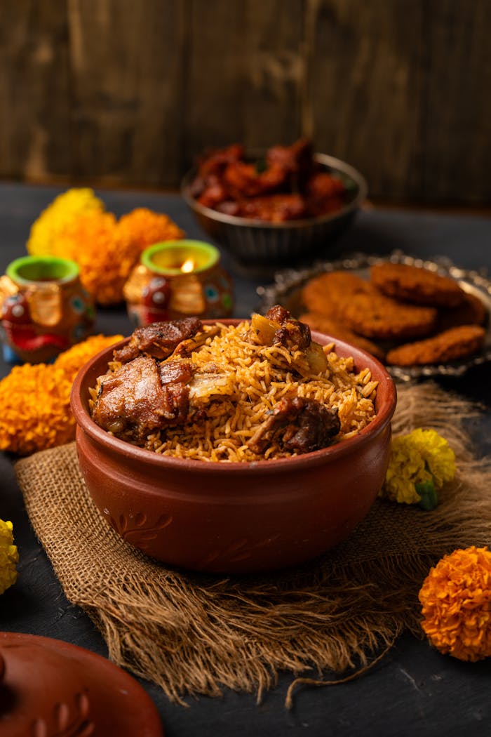 why-choose-us Delicious chicken biryani served in a traditional clay pot with colorful garnishes.