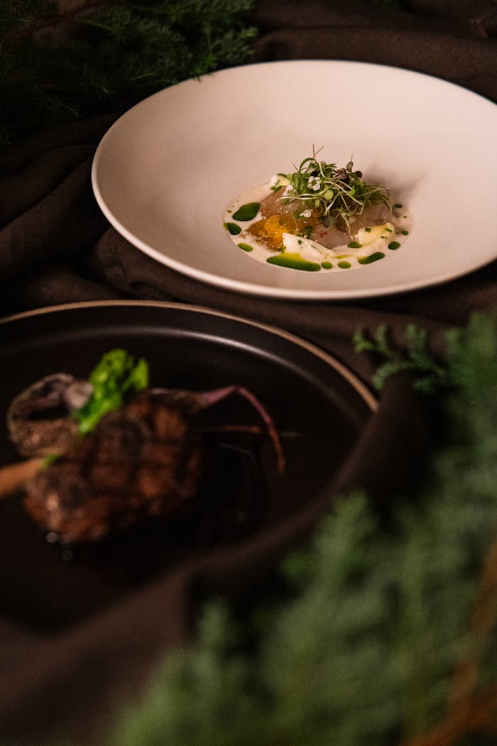 gallery-6 Close-up of elegantly plated fine dining dishes at a Tokyo restaurant, showcasing culinary artistry.